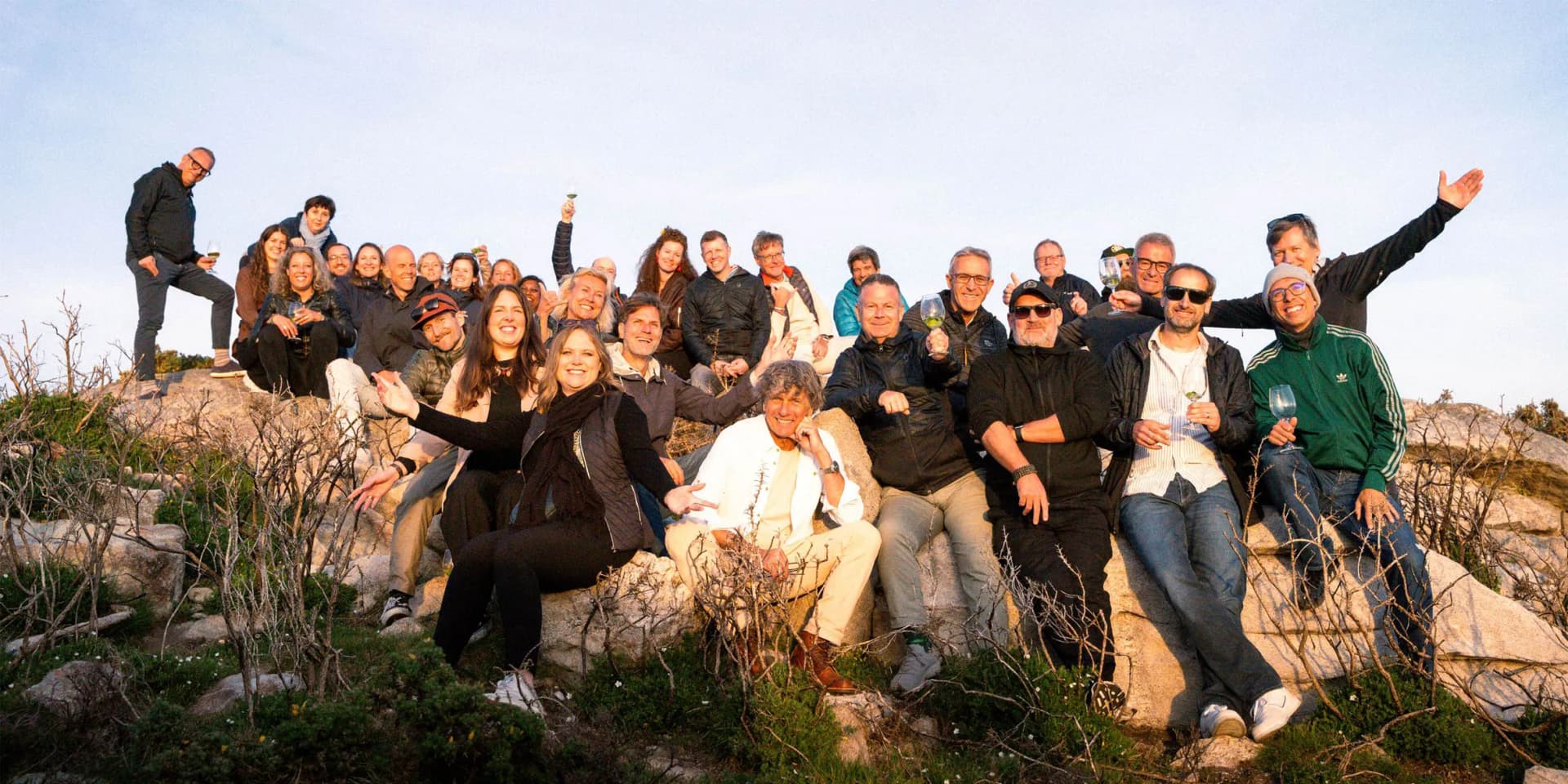 The Globetrotter leadership group of 33 gathered on a hilltop at sunset during their 50th anniversary program in Northern Portugal