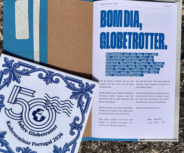 The custom-printed Globetrotter roadbook titled Bom Dia, Globetrotter with a 50 Jahre Globetrotter, Kaderseminar Portugal 2026 tile cover